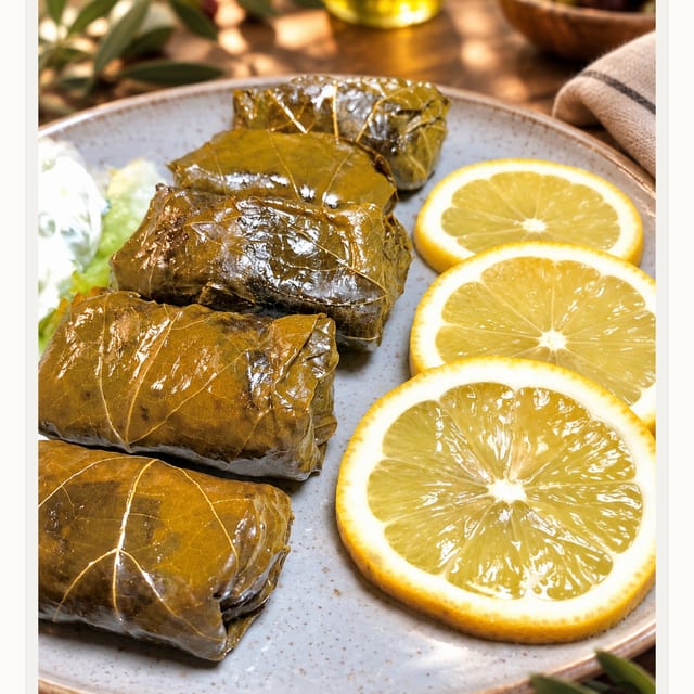 Dolmades with side Tzatziki.